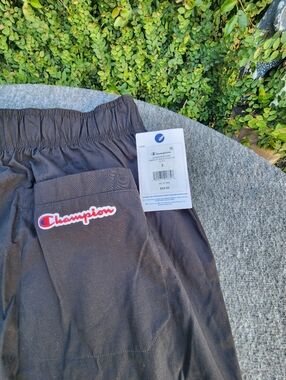 Champion Black Pants with Red & White Logo Patch